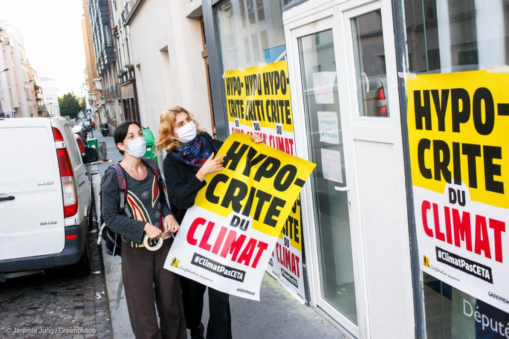Poster Action Covering Parliamentary Offices in ParisAction de recouvrement des permanences parlementaires des députés ayant voté en faveur du CETA.